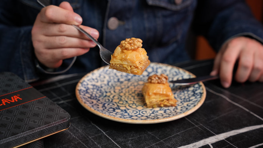 A piece of walnut baklava on a plate at the Back-Lava Café